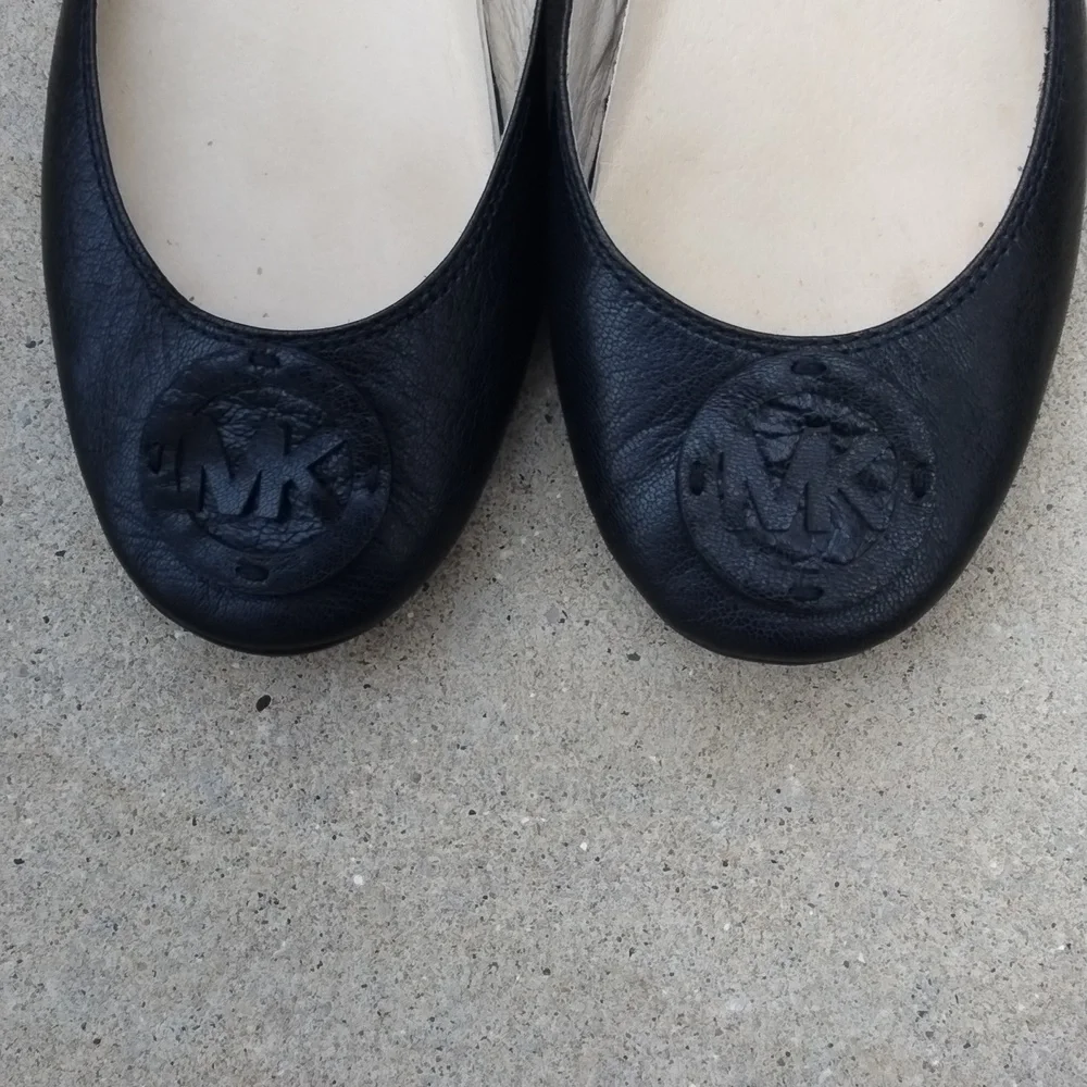 Michael Kors black leather flats with MK logo. Size 7.5
